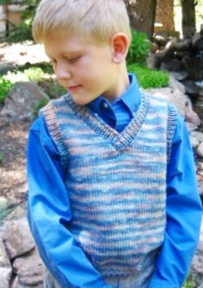 A boy wearing a knitted vest