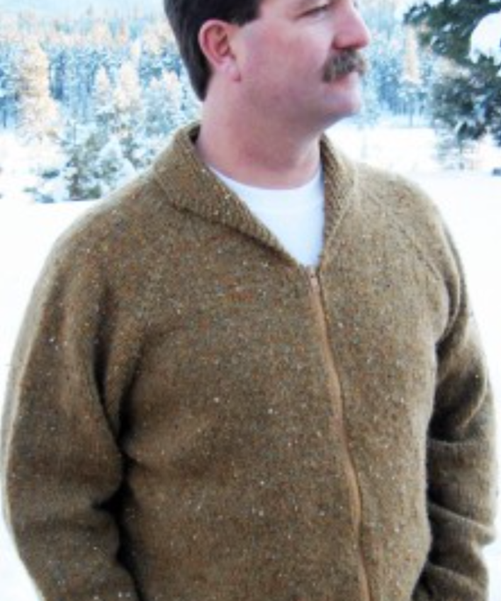 A man wearing a knitted sweater