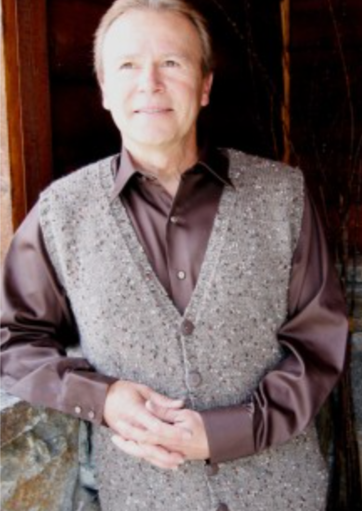 A man wearing a knitted vest