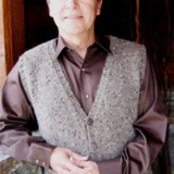 A man wearing a knitted vest