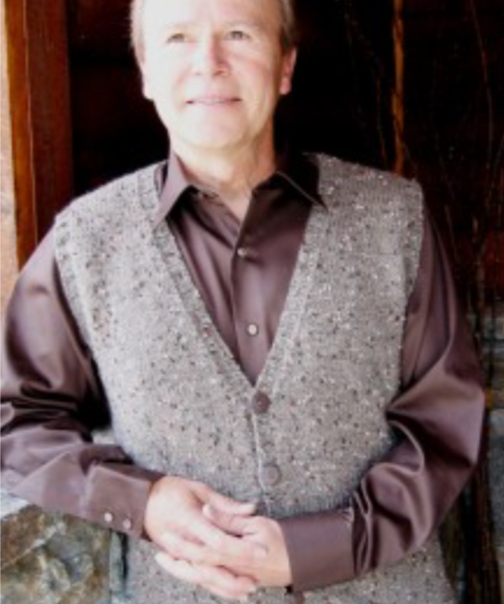 A man wearing a knitted vest