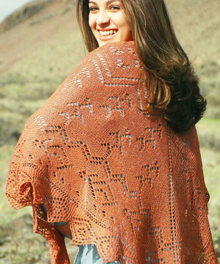 A woman wearing a knitted shawl