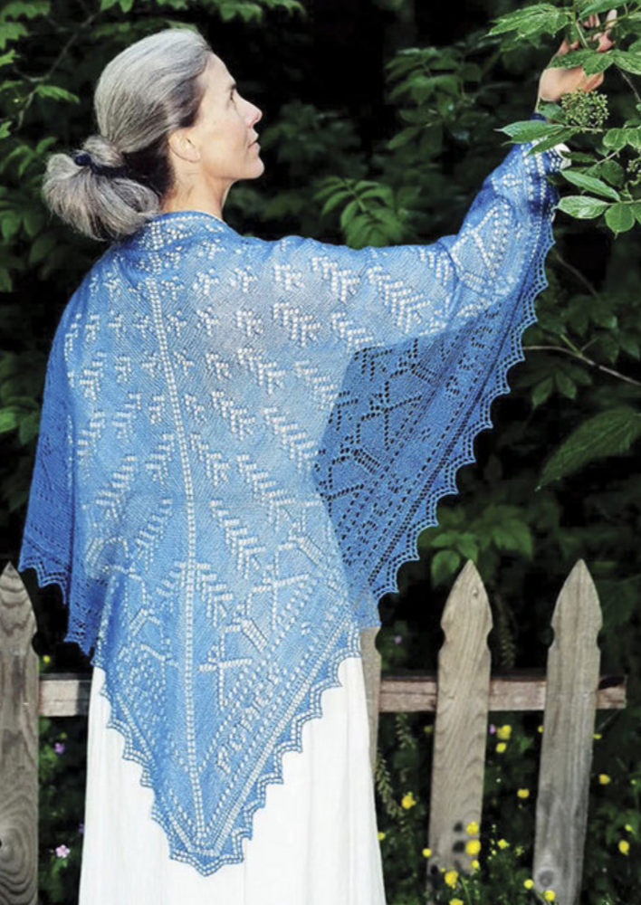 A woman wearing a knitted shawl