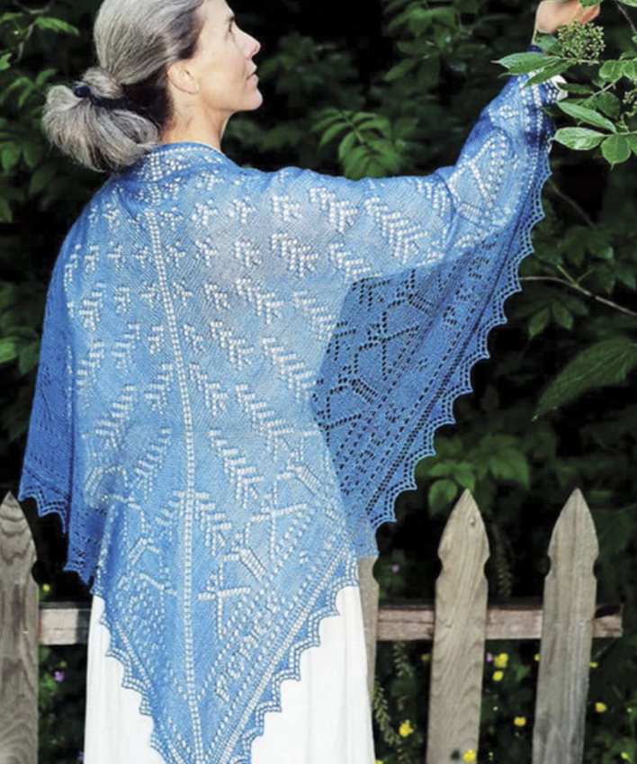 A woman wearing a knitted shawl