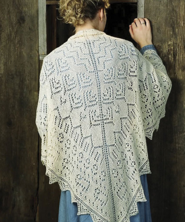 A woman wearing a knitted shawl