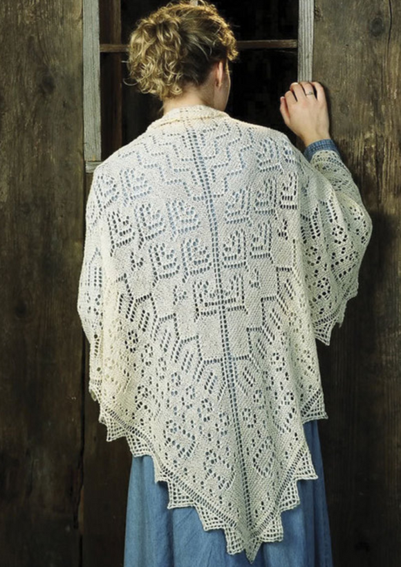 A woman wearing a knitted shawl