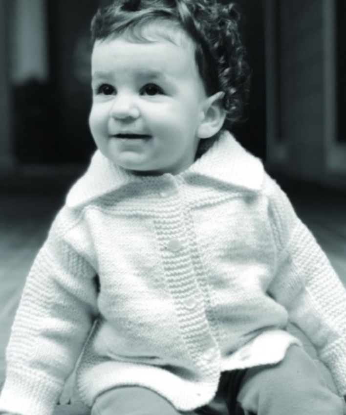 A baby wearing a knitted sweater