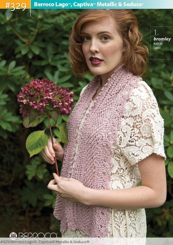 woman in lacy top wearing a pink knitted scarf, holding red flowers