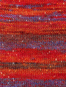 Swatch of Berroco Sesame Yarn Color red, orange, blue