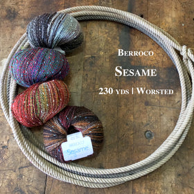 Balls of Berroco Sesame yarn on a wooden surface