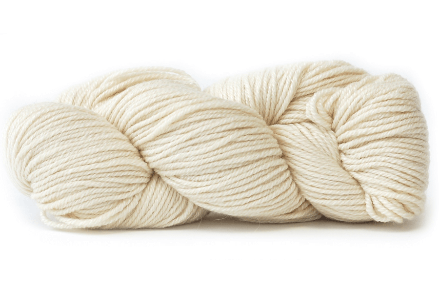 A photo of a cream colored hank of Simplinatural yarn.