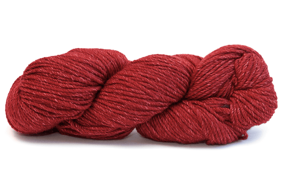 A photo of a red hank of Simplinatural yarn.