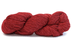 A photo of a red hank of Simplinatural yarn.