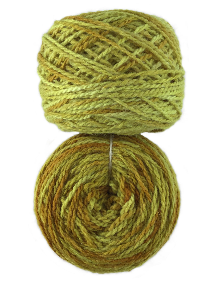 Photo of two balls of yellow Tronstad yarn