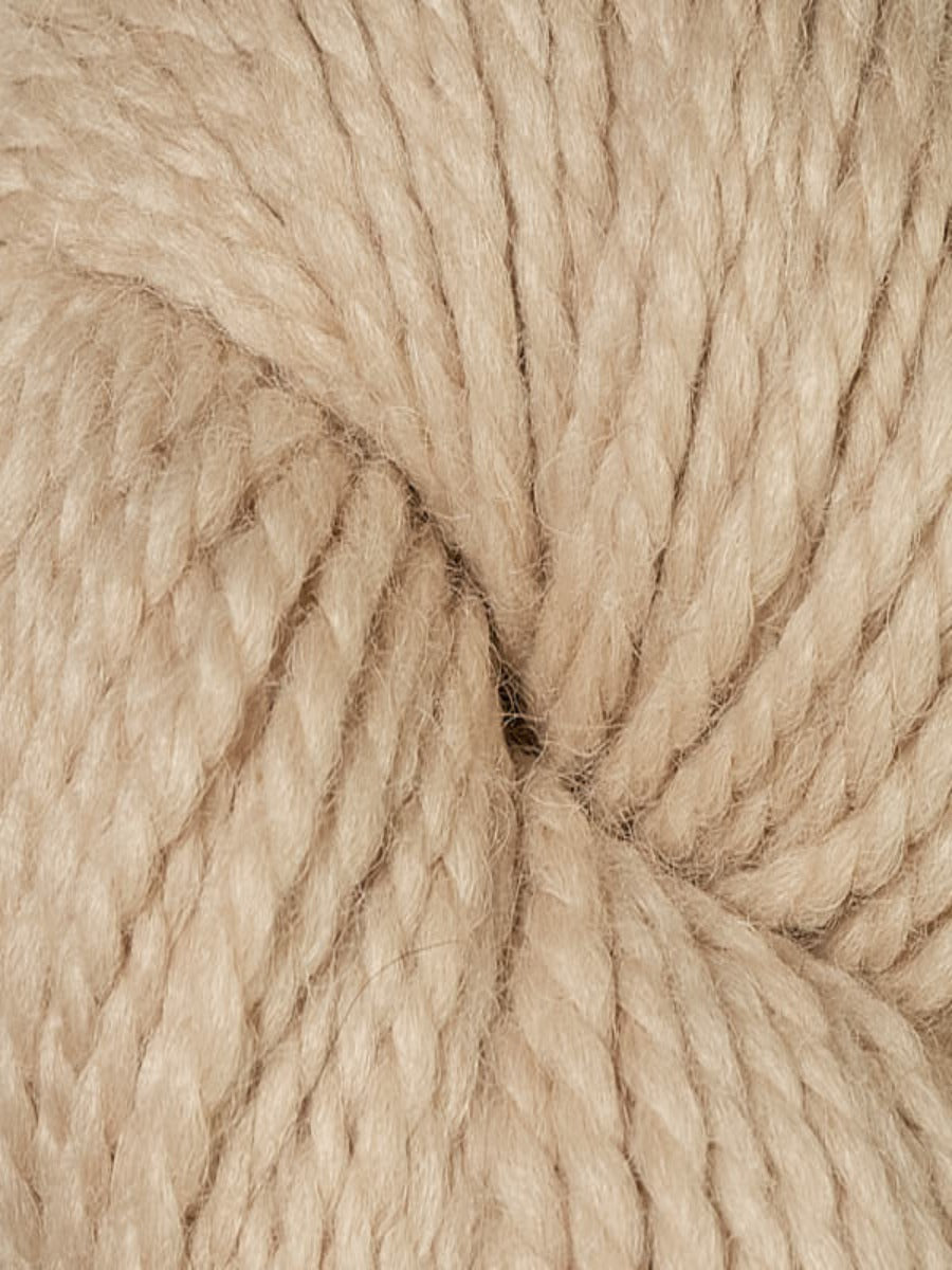 An up close shot of Berroco Ultra Alpaca Chunky Natural in colorway Spelt, a light sandcolor.