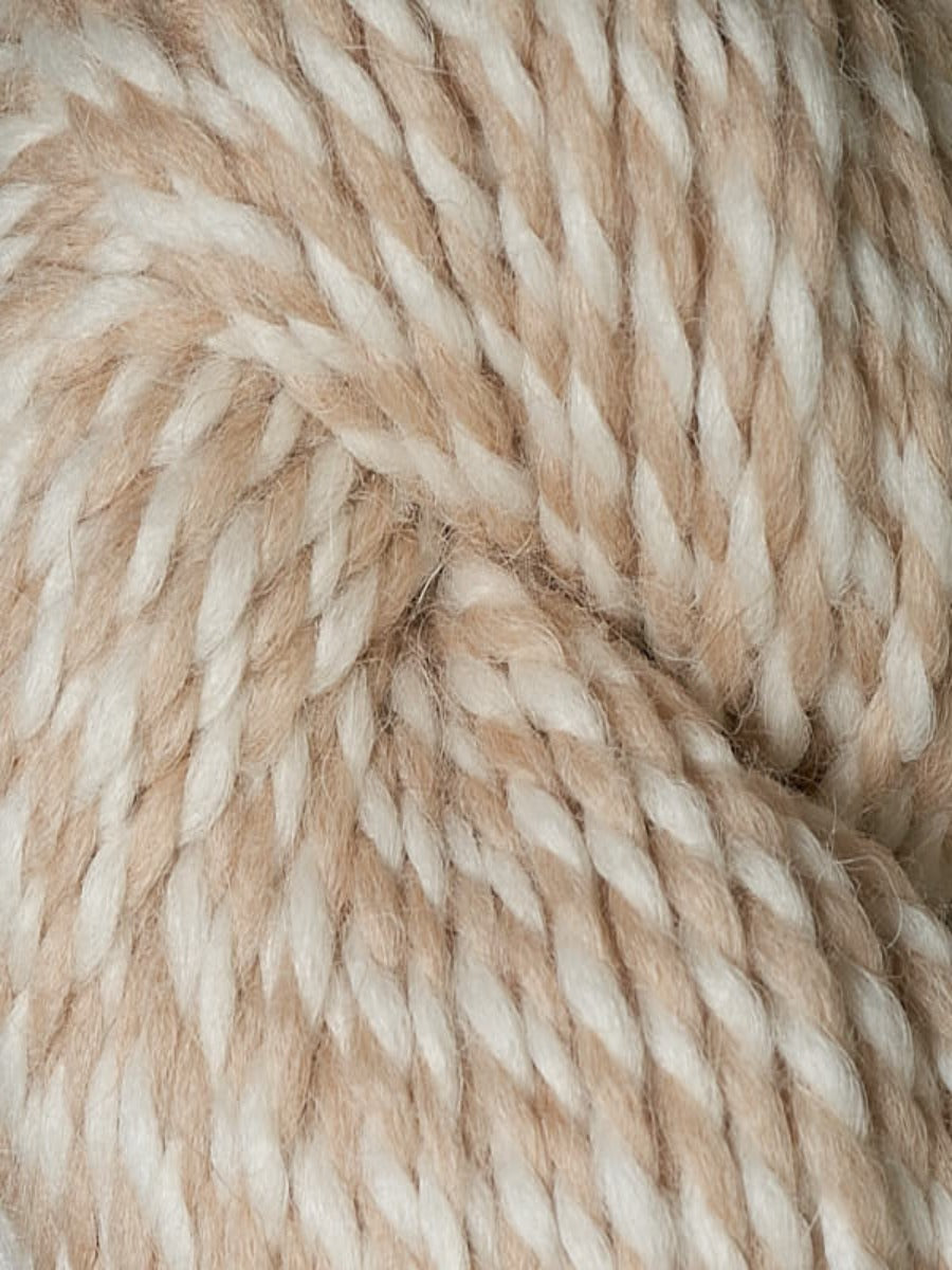 An up close shot of Berroco Ultra Alpaca Chunky Natural in colorway Sourdough, a 2-ply white and camel color.