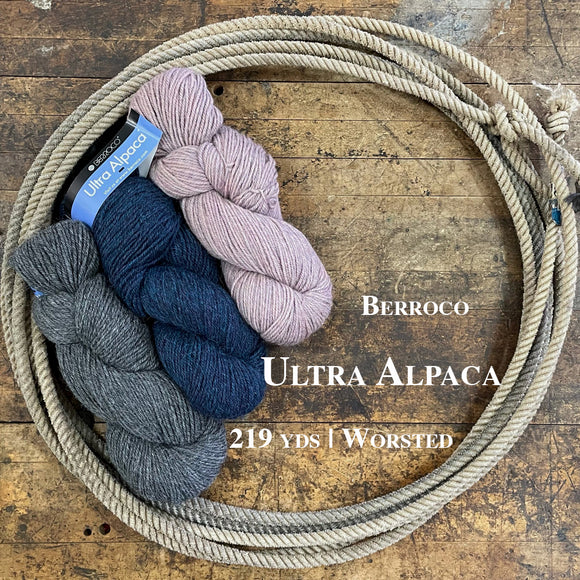 Skeins of Ultra Alpaca yarn on a wooden surface