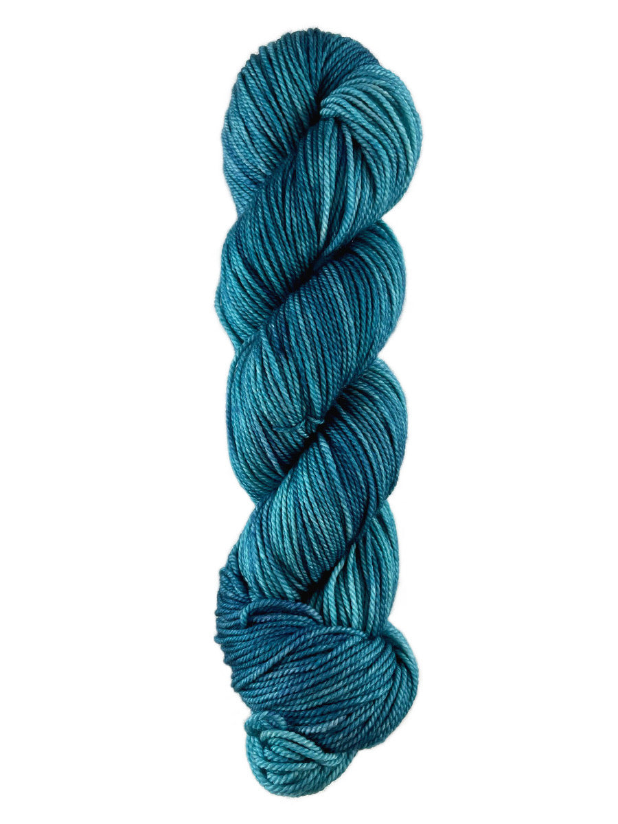 A blue skein of Western Sky Knits Merino 17 DK yarn
