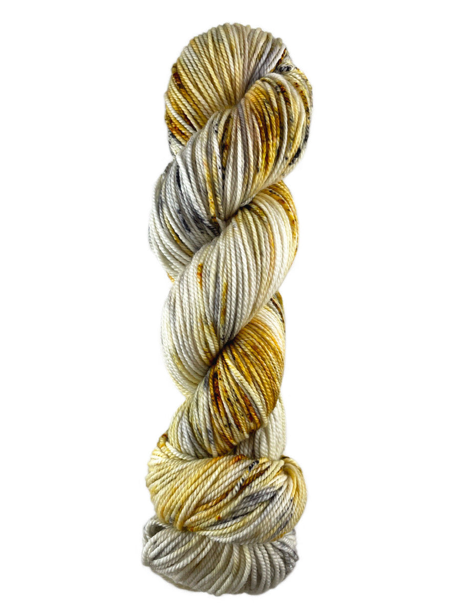 A grey  and yellow skein of Western Sky Knits Merino 17 DK yarn