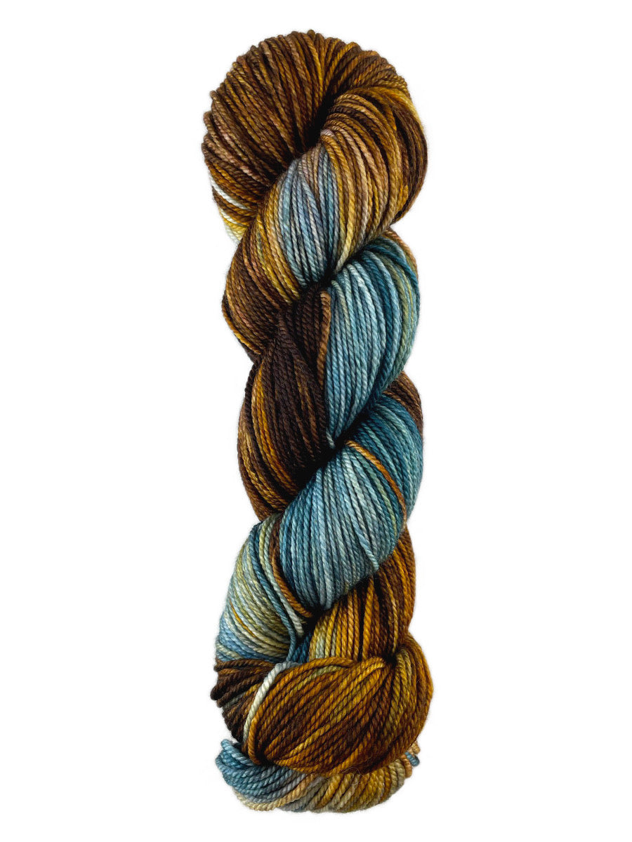 A teal and copper skein of Western Sky Knits Merino 17 DK yarn
