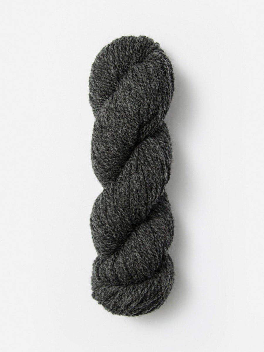 Skein of Blue Sky Fibers Woolstok yarn in the color dark heathered grey