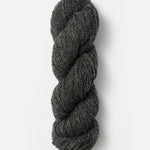 Skein of Blue Sky Fibers Woolstok yarn in the color dark heathered grey