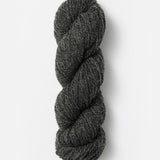 Skein of Blue Sky Fibers Woolstok yarn in the color dark heathered grey
