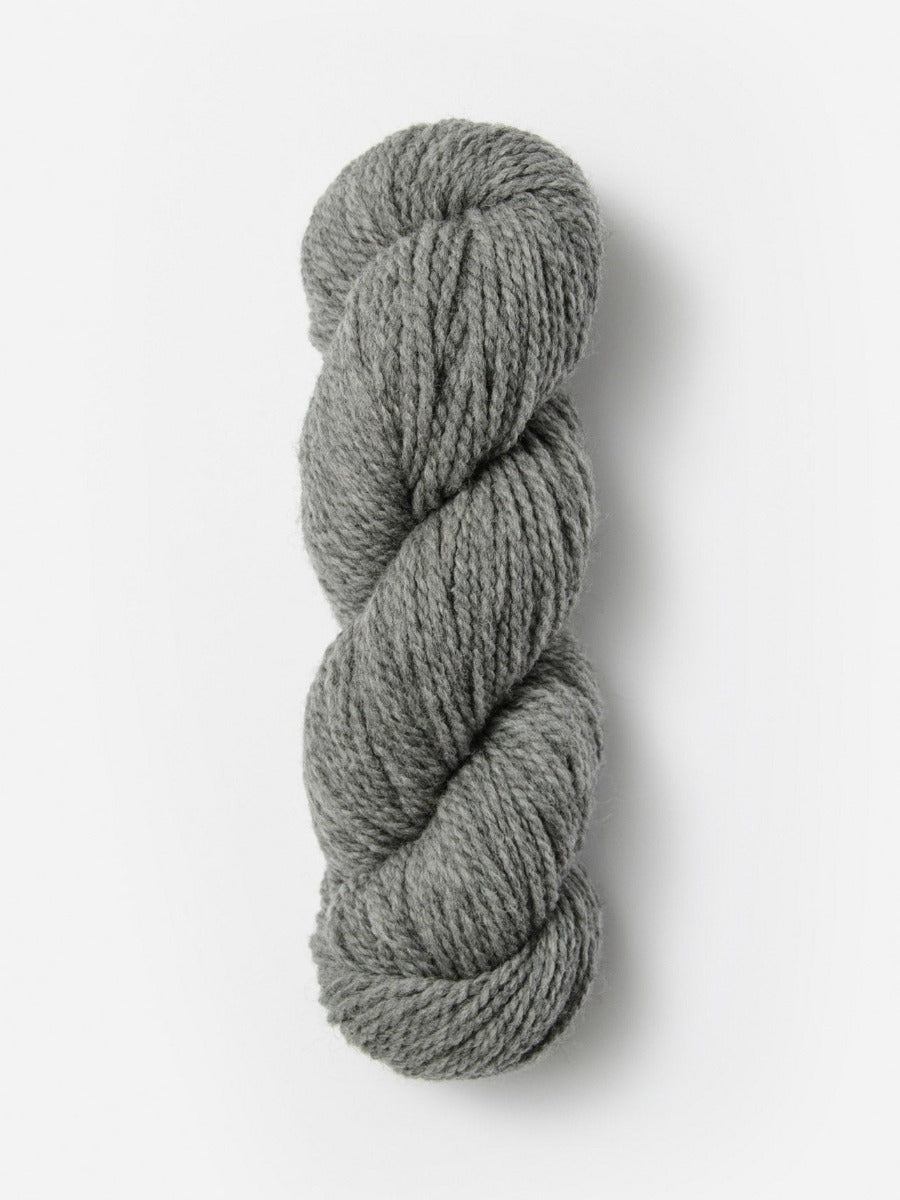 Skein of Blue Sky Fibers Woolstok yarn in the color light grey