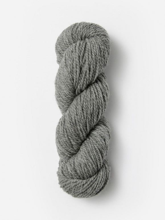 Skein of Blue Sky Fibers Woolstok yarn in the color light grey