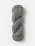 Skein of Blue Sky Fibers Woolstok yarn in the color light grey