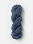 Skein of Blue Sky Fibers Woolstok yarn in the color denim blue