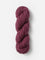 Skein of Blue Sky Fibers Woolstok yarn in the color mauve