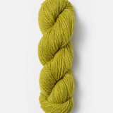 Skein of Blue Sky Fibers Woolstok yarn in the color yellow