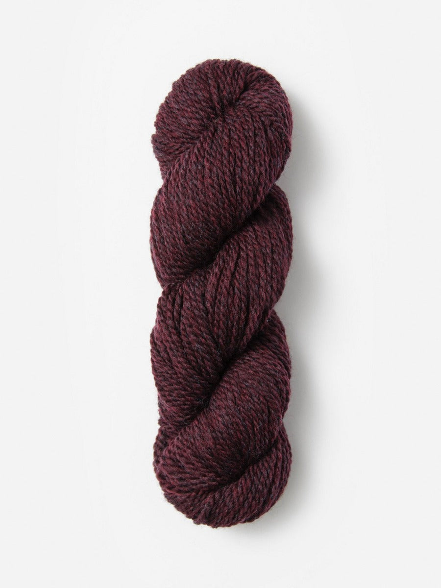 Skein of Blue Sky Fibers Woolstok yarn in the color maroon
