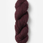 Skein of Blue Sky Fibers Woolstok yarn in the color maroon