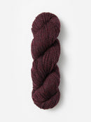 Skein of Blue Sky Fibers Woolstok yarn in the color maroon