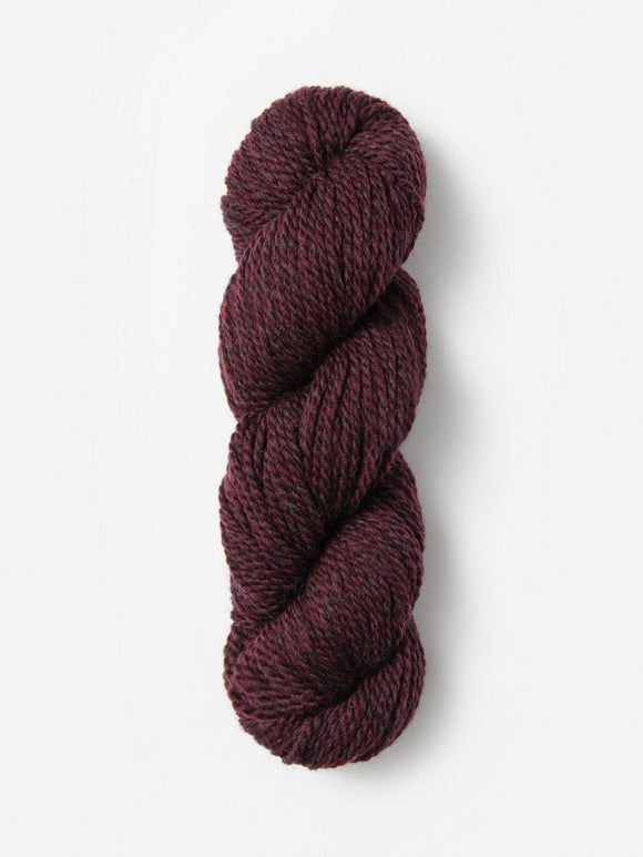 Skein of Blue Sky Fibers Woolstok yarn in the color maroon
