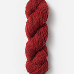 Skein of Blue Sky Fibers Woolstok yarn in the color red