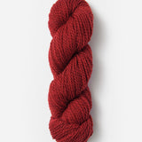 Skein of Blue Sky Fibers Woolstok yarn in the color red