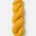 Skein of Blue Sky Fibers Woolstok yarn in the color yellow