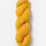 Skein of Blue Sky Fibers Woolstok yarn in the color yellow