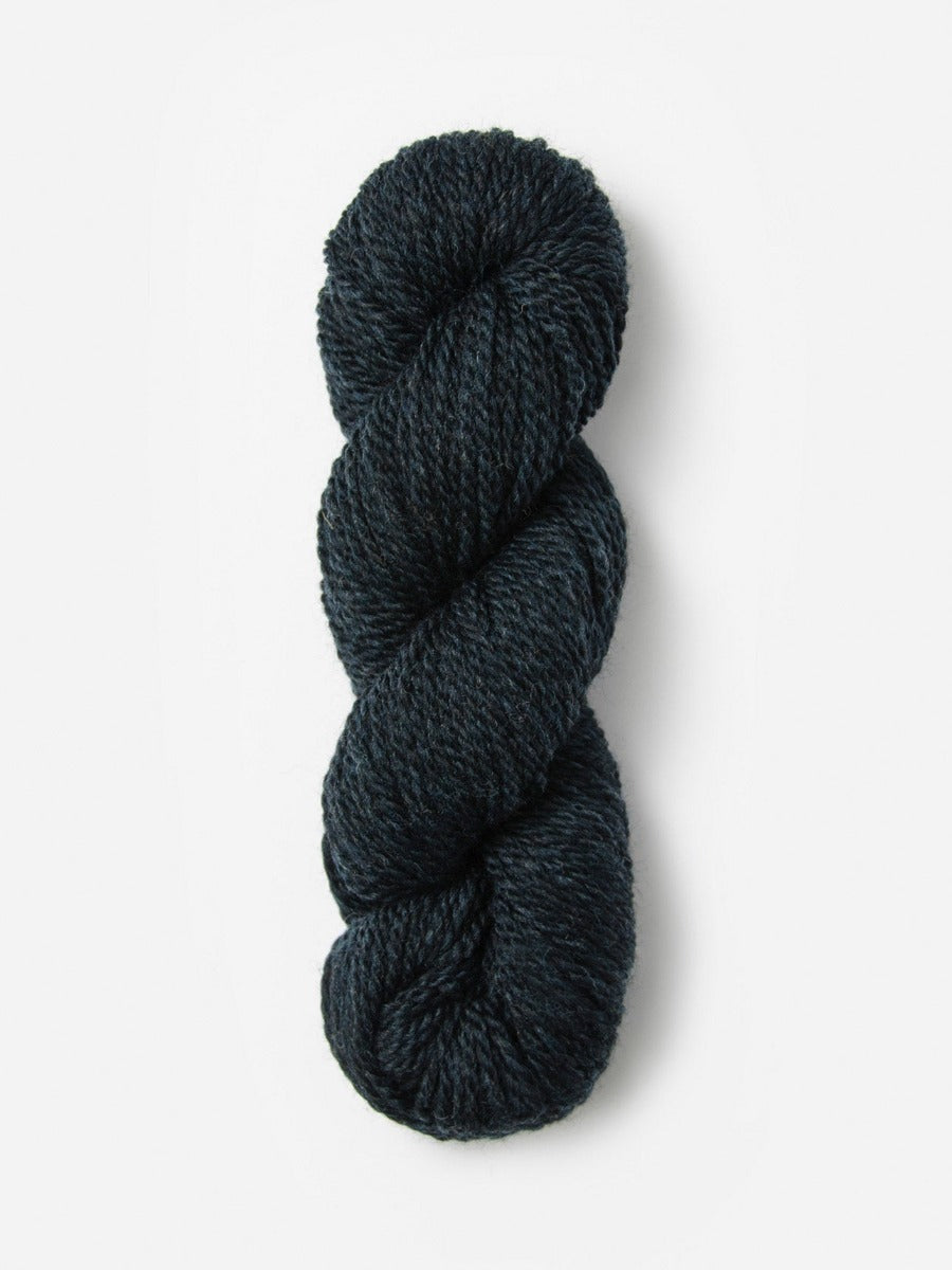 Skein of Blue Sky Fibers Woolstok yarn in the color dark navy blue
