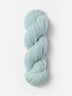 Skein of Blue Sky Fibers Woolstok yarn in the color light blue