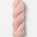Skein of Blue Sky Fibers Woolstok yarn in the color light pink