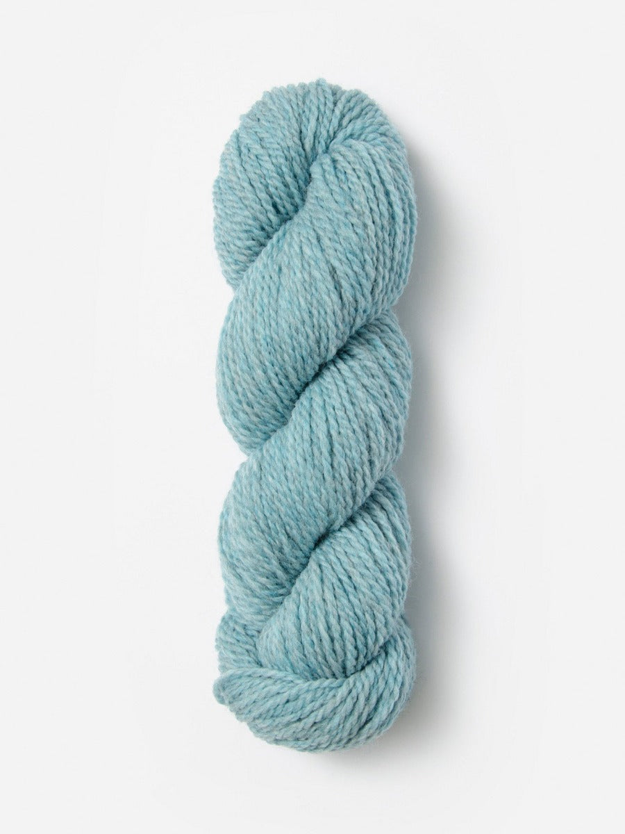 Skein of Blue Sky Fibers Woolstok yarn in the color sky blue