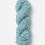 Skein of Blue Sky Fibers Woolstok yarn in the color sky blue