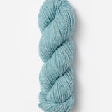 Skein of Blue Sky Fibers Woolstok yarn in the color sky blue