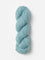 Skein of Blue Sky Fibers Woolstok yarn in the color sky blue