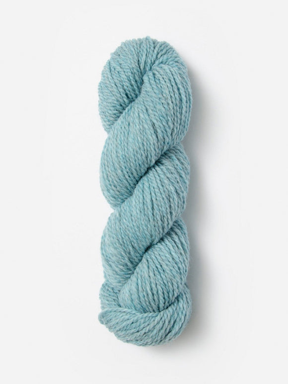 Skein of Blue Sky Fibers Woolstok yarn in the color sky blue