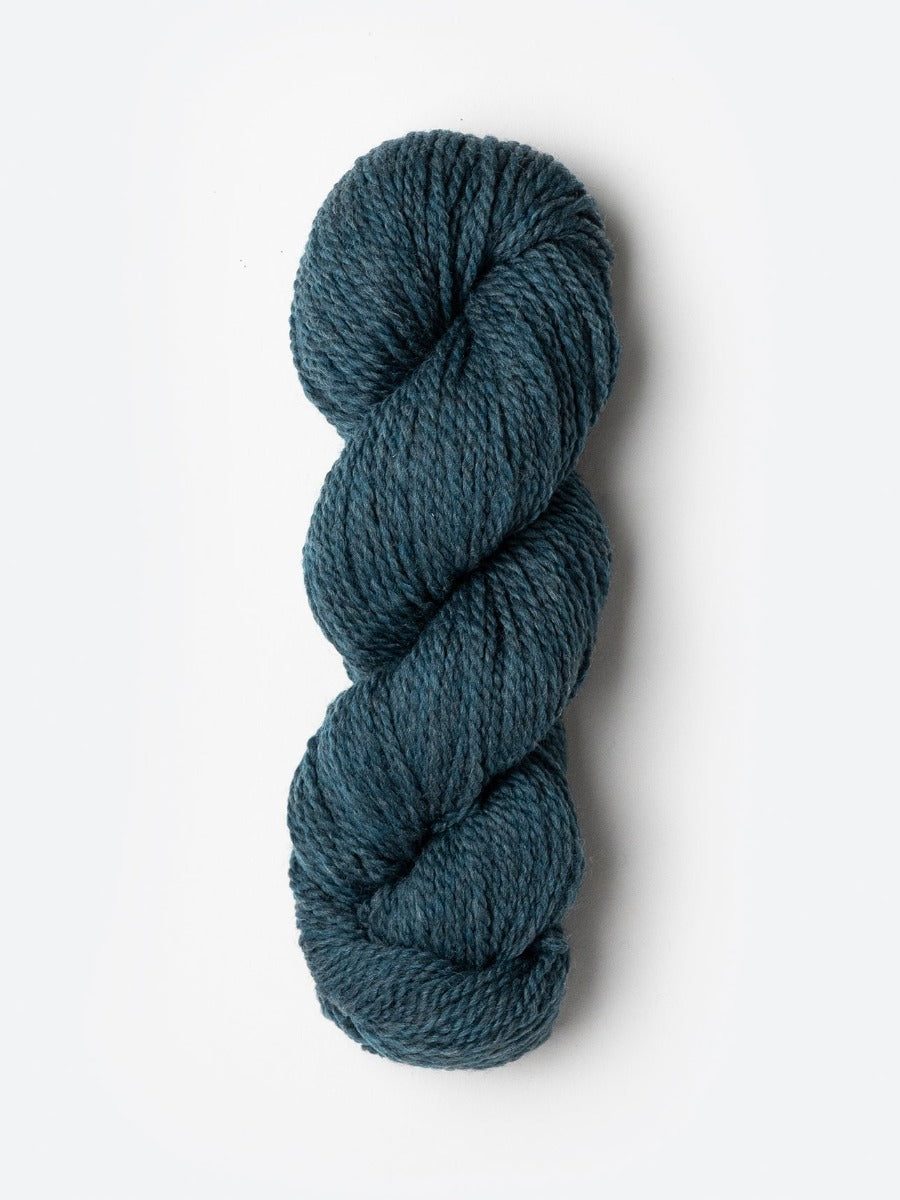 Skein of Blue Sky Fibers Woolstok yarn in the color teal